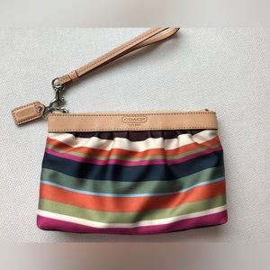 Multi colored striped Coach wristlet